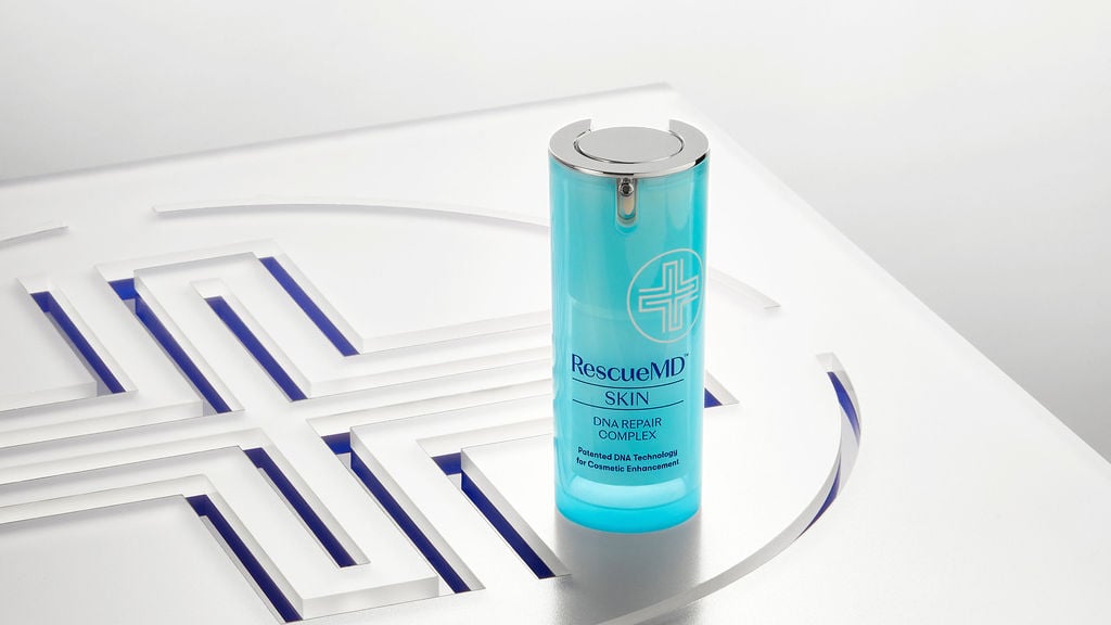 bottle of rescuemd skin dna repair complex on logo surface